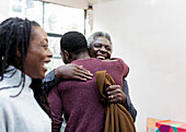 Happy grandfather hugging grandson