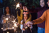 Family celebrating with sparklers