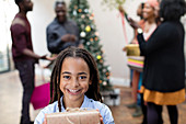 Portrait smiling girl with Christmas gift