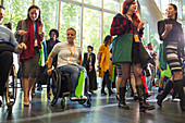 People arriving at conference, entering lobby