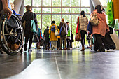 Business people leaving conference lobby