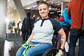 Young woman in wheelchair at conference
