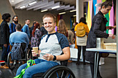 Portrait woman in wheelchair at conference