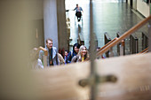 Business people ascending stairs