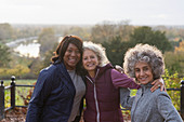 Portrait active senior women friends in autumn park