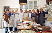 Senior friends and chef taking pizza cooking class
