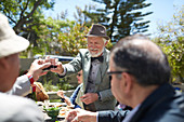 Senior man toasting with wine