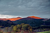 Sunlight illuminating tranquil mountaintops, Scotland