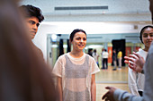 Teenagers talking in dance class studio