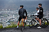 Male cyclist friends taking a break