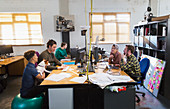 Creative business people working, meeting at computers