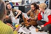 Creative business people meeting, reviewing paperwork