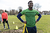 Portrait confident, smiling young man exercising in park