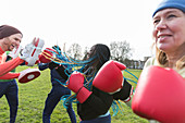 People boxing in park