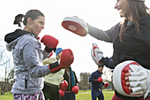 Determined women boxing in park