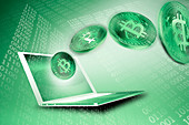 Green Bitcoins and laptop