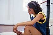 Young female dancer listening to music