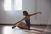 Graceful young female dancer practicing