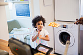 Curious toddler girl waiting for waffles