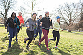 Smiling female runners running