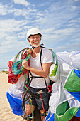 Smiling mature male paraglider