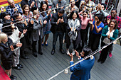 Business people clapping for businessman