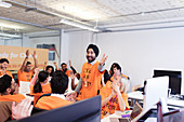 Enthusiastic hackers cheering, coding at hackathon