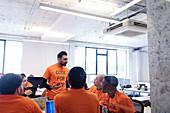 Hacker leading discussion, coding at hackathon