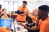Hackers celebrating and coding at hackathon