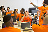 Happy hackers coding at hackathon