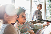 Mother and daughter reading book