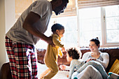 Playful multi-ethnic family in pyjamas