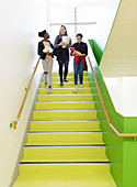 High school girls descending stairs