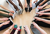 Active seniors stretching legs in circle