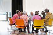 Active seniors talking in circle