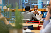 Businessmen with smart phone working in cafe