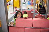 Playful girl playing at construction exhibit