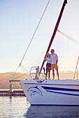 Couple hugging on catamaran