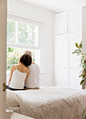 Serene senior couple sitting on bed