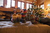 Family with colourful socks relaxing
