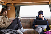 Teenage brother and sister in motor home