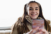Portrait girl texting with smart phone