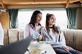 Mother and daughter eating in motor home