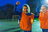Portrait girl soccer players cheering