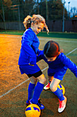 Girl soccer players practicing