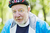 Portrait active senior man wearing bicycle helmet