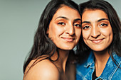 Portrait teenage twin sisters