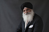 Portrait senior man with beard in turban