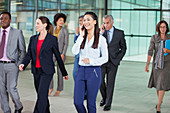 Smiling businesswoman talking on cell phone