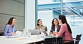 Happy businesswomen talking in meeting